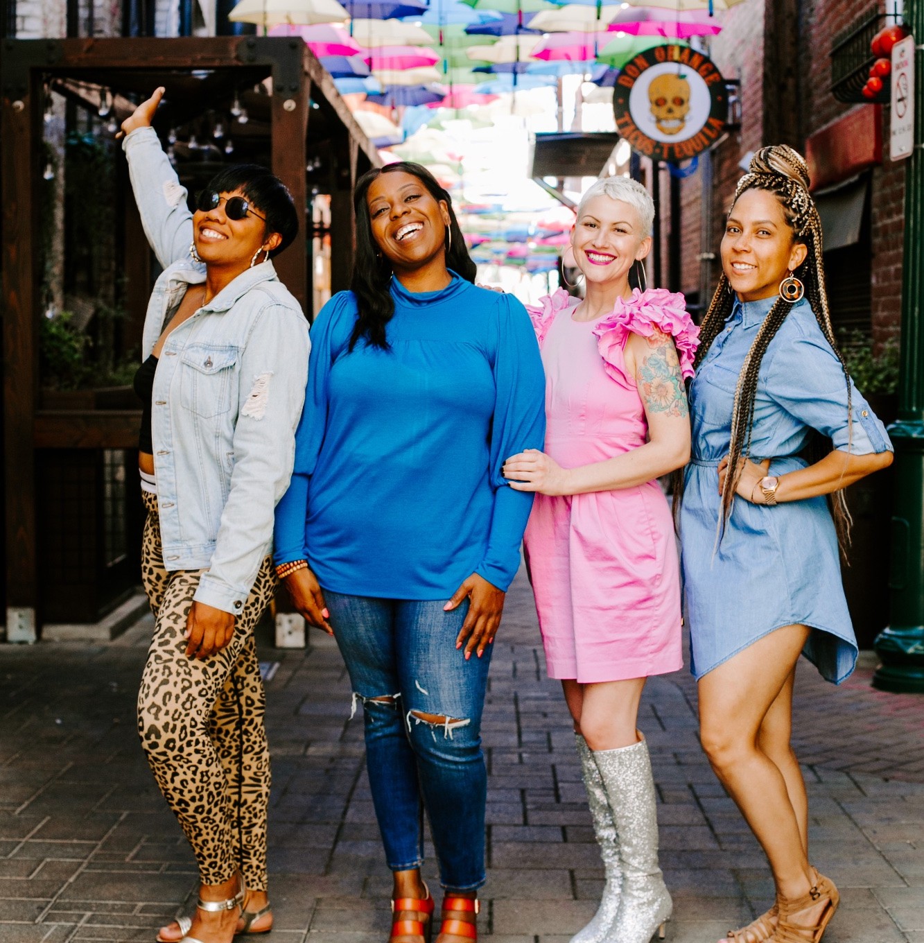 Four women together at a She Stories event
